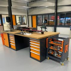 an orange and black workbench in a garage