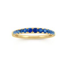 This stylish ombre ring features natural gemstones and makes a gorgeous addition to any jewelry collection. It’s crafted in warm 14-karat yellow gold with blue sapphires that increase in size and darken in shade as they reach the center of the ring. Blue Sapphire Half Eternity Ring In 14k Gold, Blue Multi-stone Sapphire Ring In 14k Gold, Fine Jewelry Yellow Gold Sapphire Ring With Accent Stones, Yellow Gold Sapphire Ring With Round Band, Multi-stone Sapphire Ring In Yellow Gold, Gold Sapphire Half Eternity Ring, Yellow Gold Sapphire Birthstone Ring In Fine Jewelry Style, 14k Gold Sapphire Half Eternity Ring, Yellow Gold Stackable Sapphire Ring