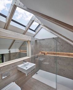 an instagram photo of a bathroom with skylights