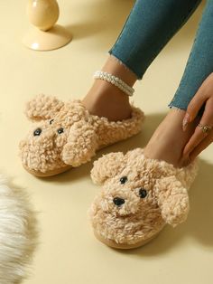 a pair of women's slippers with poodles on the toes and feet