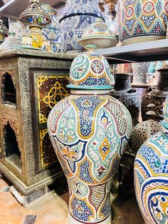 Moroccan decorative urn in openwork metal, measuring one meter in height and 40 centimeters in width. Its hand-carved patterns bring a touch of elegance and authenticity to your space. Ideal for enhancing the decoration of your interior with a unique oriental charm. Moroccan Vase, Ceramic Urn, Home Accents, Morocco, Hand Carved, Carving, Vase, Ceramics, Collage