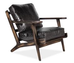 a black leather chair sitting on top of a wooden frame