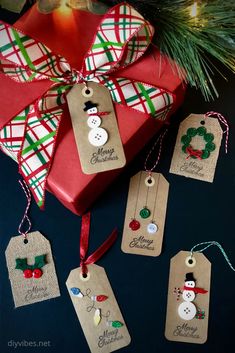 christmas gift tags hanging from a tree