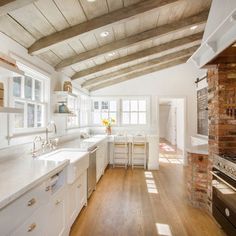 a kitchen with an oven, sink and stove top in it's center island