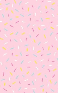 pastel sprinkles on a pink background