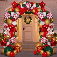 an arch decorated with christmas balloons and candy canes