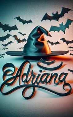 the word adriang with a witch's hat and bats in the background