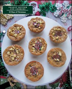 twelve cookies are arranged on a white plate