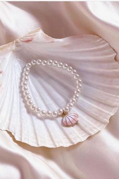 The most precious summer accessory ~ cute as can be and the perfect pop of pearl! Name a better accessory to your LoveShackFancy pieces. Handmade One size fits most ~ elastic band Pearl bracelet with charm detail Adjustable Pearl White Stretch Bracelet With Pearl Charm, Summer Stretch Bracelet As Gift, Trendy White Pearl Bracelet With Pearl Charm, Trendy Beaded Bracelets With Pearl Charm, Trendy Beaded Pearl Bracelets With Charm, Cute Pearl Jewelry With Pearl Charm, Cute Pearl Charm Jewelry, Cute White Pearl Bracelet, Trendy Pearl Bracelet With Charm As Gift