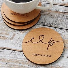 coasters with the words forever in love written on them and a cup of coffee