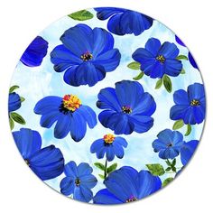 blue flowers on a white background with green leaves and yellow centers in the center is a circular glass plate