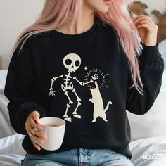 Calling all cat lovers and spooky season enthusiasts!  This adorable sweatshirt features a high-fiving skeleton and a cool cat, all surrounded by sparkling fun!  ✨  Whether you're rocking it at a Halloween party  or cozying up for a spooky movie night, this sweatshirt is sure to bring a smile (and maybe a purr!)    It's also the purrfect gift for any cat mom or Halloween fanatic in your life!   Key features you'll love: * Unique and eye-catching retro Halloween design   * Super soft and comfy fo Spooky Movie Night, Fall Cat, Skeleton Cat, Cat Mom Sweatshirt, Fall Cats, Spooky Movies, The Only Exception, Halloween Skeleton, Cat Stuff