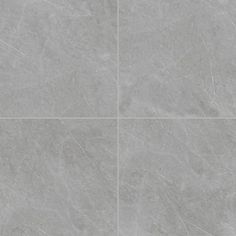 a grey tile floor with four squares in the middle