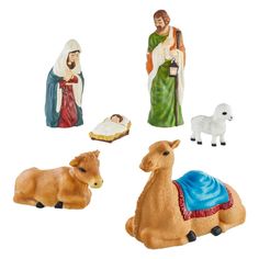 four nativity figurines including a baby jesus, an infant jesus and a donkey