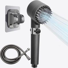 an image of a shower head with the light on and hose attached to it's side