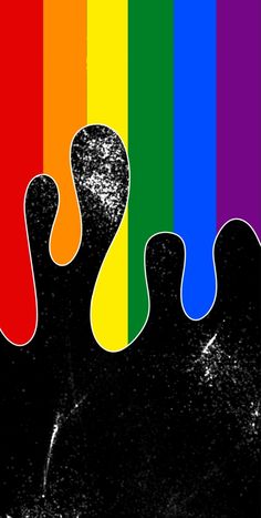 a person's feet are shown in front of a rainbow colored background with black spots