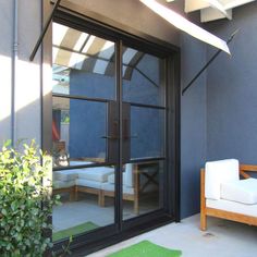 an open patio door leading into a living room