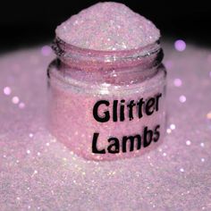 a pink glitter jar with the words glitter lambs written on it