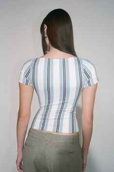 Meet the Olivia Top in Black and Blue Stripe. This fitted top features a bullet padded bra for added support and a cinched waist for a flattering fit. True to size. Please refer to the flat-lay image for product accuracy. Blue Cropped Elastane Top, Blue Fitted Stretchy Crop Top, Blue Fitted Elastane Crop Top, Fitted Blue Elastane Crop Top, Mimi Wade, Corset Back Dress, Statement Dress, Fitted Top, Padded Bra