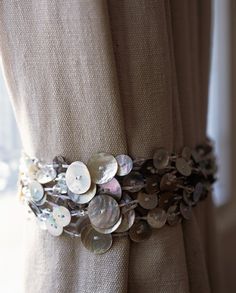 a close up of buttons on a curtain