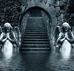 some angel statues sitting in front of a set of stairs with water running down them