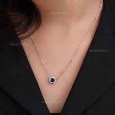 Round Blur Sapphire Pendant Necklace Birthstone Jewelry Halo Pendant Necklace for Women Classic Silver Pendant with Sapphire & Moissanite Round Cut Moissanite Pendant Necklace / Moissanite Diamond Round Necklaces for Women / Solid Gold Necklace  Pendant Features * Material: 14k Solid Gold, 18k Solid Gold, Silver * Gold Color: Rose Gold, Yellow Gold, White Gold * Necklace Length: 14 Inches - 20 Inches * Center Stone Cut: Round Blue Sapphire * Side Stone  : Round Cut Moissanite * Pendant With Chai Sapphire Diamond Necklace Fine Jewelry, Sapphire Round Diamond Necklace In Fine Jewelry Style, Sapphire Diamond Necklace In Round Shape, Elegant Blue Crystal Necklace With Clavicle Chain, Blue Sapphire Birthstone Necklace For Anniversary, Sapphire Round Cut Necklaces For Formal Occasions, Elegant Blue Crystal Pendant Necklace, Elegant Blue Pendant Crystal Necklaces, Elegant Blue Pendant Crystal Necklace