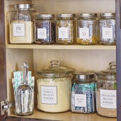 the shelves are filled with different types of spices