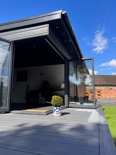 an open patio with sliding glass doors on the outside