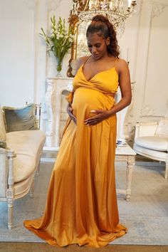 Satin Golden Yellow spaghetti strap style Maternity Wrap Gown Satin Maternity Dress, Pregnancy Photos Ideas, Yellow Maternity Dress, Pink Maternity Gown, Maternity Evening Gowns, Dress For Baby Shower, Lace Maternity Gown, Maternity Dresses For Baby Shower, Blue Champagne