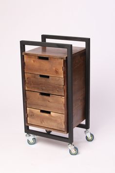 a wooden drawer sitting on top of a metal frame with four drawers and wheels in front of a white background