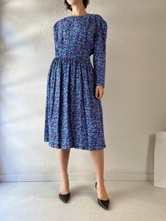 - Vintage Karen Stevens blue floral print dress - 100% rayon - Zipper up the back - Tagged 14 Bust: 19"  Waist: 14" Length: 44" We are not responsible for lost, stolen, or damaged packages once they have been shipped. Any additional customs duties or taxes incurred on international orders are the responsibility of the buyer. Please note that our items are vintage and may have minor flaws or imperfections due to their age, which adds to their unique character. Spring Blue Midi Dress With Ditsy Floral Print, Blue Midi Dress With Ditsy Floral Print For Spring, Blue Ditsy Floral Print Midi Dress For Spring, Fitted Blue Midi Dress With Ditsy Floral Print, Blue Ditsy Floral Print Knee-length Dress, Blue Floral Dress With Ditsy Floral Print, Blue Knee-length Ditsy Floral Dress, Fitted Blue Ditsy Floral Dress, Blue Fitted Dress With Ditsy Floral Print