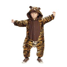 a little boy in a tiger costume standing with his arms spread out and hands up