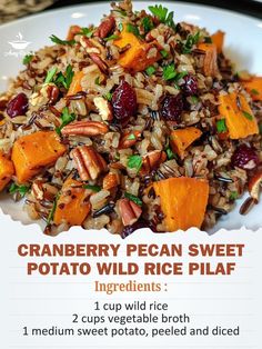 a white plate topped with wild rice and cranberry pecan sweet potato salad