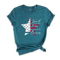 a women's t - shirt that says land of the free because of the brave