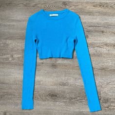 Pull And Bear Knit Long Sleeve Crop Top In Blue. Very Breathable And Light. In The Size Small. Tight Fit And Very Flattering. Never Worn Trendy Cropped Blue Sweater, Trendy Blue Ribbed Sweater, Blue Cropped Casual Sweater, Casual Cropped Blue Sweater, Casual Blue Cropped Sweater, Blue Ribbed Crew Neck Crop Top, Blue Ribbed Crop Top With Crew Neck, Blue Ribbed Stretch Sweater, Fitted Blue Crop Top For Winter