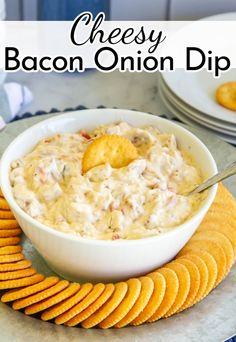 cheesy bacon onion dip with crackers on the side