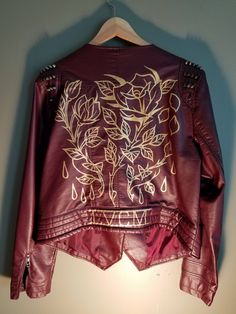 "One-of-a-kind, hand-painted faux-leather Jacket. All jackets are second-hand items, and all designs are original and unique creations. Usually Black and Gold rules everything around us, but we're making an exception for this \"Rose Gold\" design - hand-painted with gold leather paint. Designs are highly water and wear resistant. Features: Spiked shoulder Asymmetric zipper Large front breast-flaps (go crazy with those enamel pins) Faux-leather Size XL - Model is 5'11\"" Artistic Hand Painted Outerwear For Fall, Spiked Jacket, Painted Leather Jacket, Painted Jacket, Leather Paint, Go Crazy, Painting Leather, Gold Leather, Faux Leather Jackets