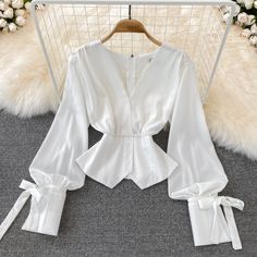 Simple v neck long sleeve tops fashion topsFabric: blendedColor: whiteSize(cm): S, M, L, XL (1inch=2.54cm)S length 53cm bust 86cm waist 66cmM length 54cm bust 90cm waist 70cmL length 55cm bust 94cm waist 74cm&ltp&gtXL length 56cm bust 98cm waist 78cm&lt/p&gt&ltbr/&gt&ltp&gtPlease check the size carefully when you choose items.&lt/p&gt&ltbr/&gt&ltp&gtFor more pictures of the dress, please contact us, thank you.&lt/p&gt&ltbr/&gt White V-neck Long Sleeve Top For Fall, Trendy Long Sleeve V-neck Top For Summer, Elegant Fitted V-neck Long Sleeve Top, Elegant White Solid Color Blouse, Solid Color V-neck Party Tops, Solid Color V-neck Blouse For Party, White Blouse For Fall, White Solid Color Top For Party, White Solid Color Blouse For Fall