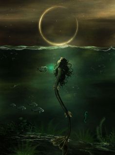 a mermaid is swimming in the ocean with her tail extended and it's head above water