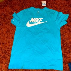 Men’s Nike Shirt New With Tags Nike Short Sleeve T-shirt With Branding, Nike Blue Shirt With Graphic Print, Blue Short Sleeve Shirt With Logo Print, Nike Blue Top With Logo Print, Nike Blue Tops With Logo Print, Nike Blue Casual Shirt, Nike Casual Blue Shirt, Casual Blue Nike Shirt, Blue Crew Neck Shirt With Logo Print