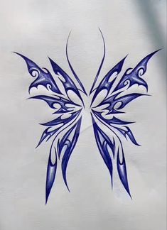 a drawing of a blue butterfly on white paper