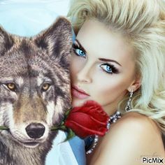 a woman with blue eyes holding a rose next to a wolf