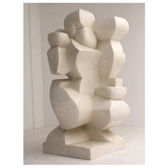 a white sculpture sitting on top of a table