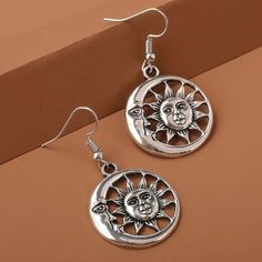 Small Moon And Sun Dangle/Drop Earrings. Beautiful Dangle Earrings With Sun And Moon, Silver Tone With Black, These Will Go With Almost Any Outfit. Earrings Drop 1 1/2 Inches, They Are Lightweight. Summer Jewelry With Sun And Moon Design, Summer Silver Alloy Earrings, Silver Moon Earrings For Festivals, Sun And Moon Design Dangle Earrings For Summer, Trendy Silver Moon-shaped Earrings, Trendy Silver Moon Earrings, Vintage Moon-shaped Metal Earrings, Sun And Moon Design Metal Earrings, Silver Half Moon Earrings With Sun And Moon Design