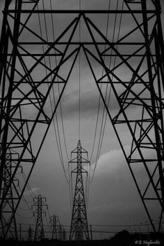 black and white photograph of high voltage power lines