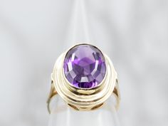 A pretty medium purple amethyst adorns the center of this vintage bezel set 14-karat yellow gold mounting, surrounded by a thick gold bezel framing the gemstone, utterly beautiful!Metal: 14K Yellow GoldGem: Amethyst 6.00 CaratsGem Measurements: 9.7 x 15.2 mm, OvalSize: 5 Ruby Solitaire Ring, Aquamarine Solitaire Ring, Art Deco Pink, Sapphire Solitaire Ring, Garnet And Gold, Gold Solitaire Ring, Sapphire Solitaire, Star Sapphire, Star Ruby