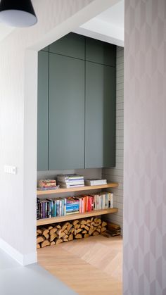 the bookshelf is made out of wood and has many different colored books on it