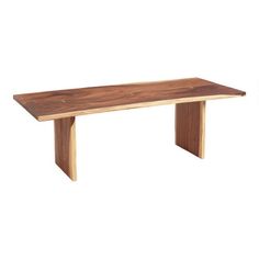 a wooden bench sitting on top of a white floor next to a table with two legs