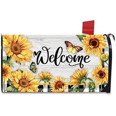 a mailbox with sunflowers and butterflies painted on the front, which says welcome