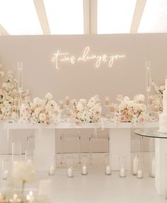 a table with flowers and candles on it